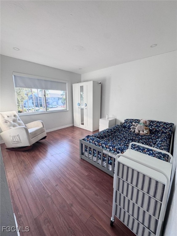 4079 Northlight Drive, Unit 1802 Naples, FL 34112 - Photo 24 of 29 a living room with hard wood floors and a couch