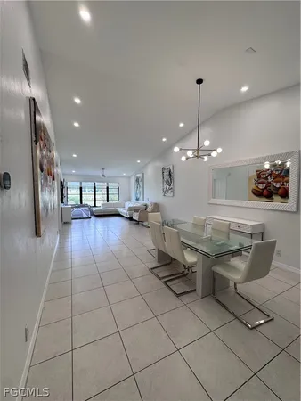 a lobby with furniture and a chandelier