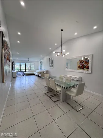 a lobby with furniture and a chandelier