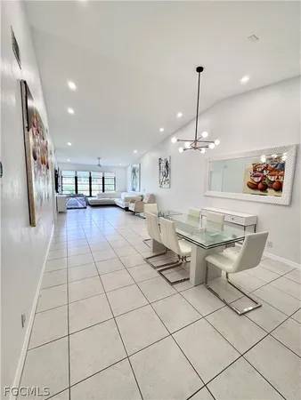 a lobby with furniture and a chandelier