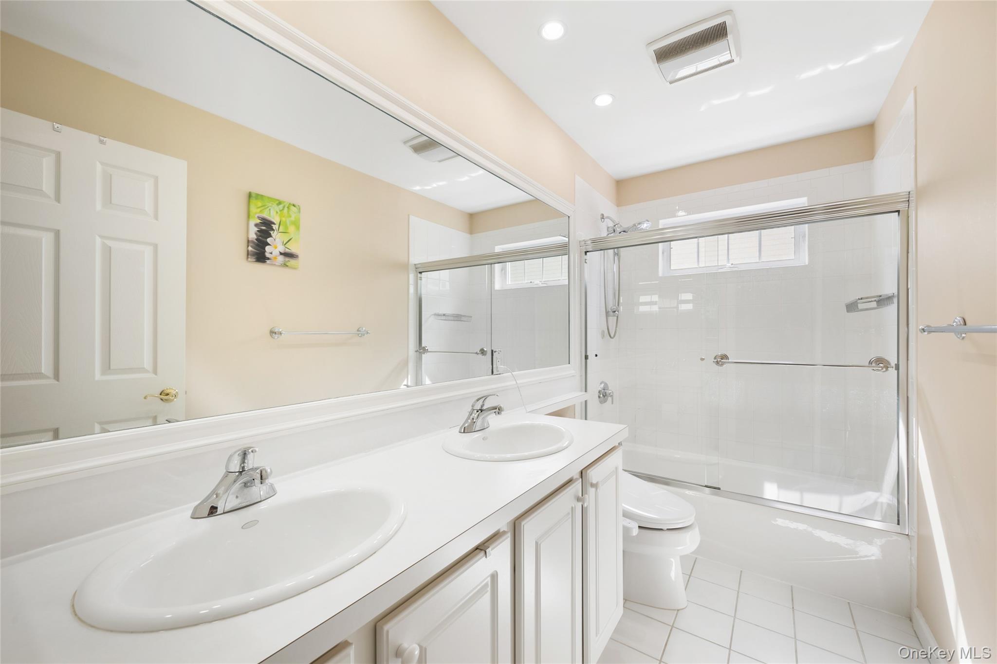 26 Bellefair Road Rye Brook, NY 10573 - Photo 17 of 25 a bathroom with a sink a toilet and shower