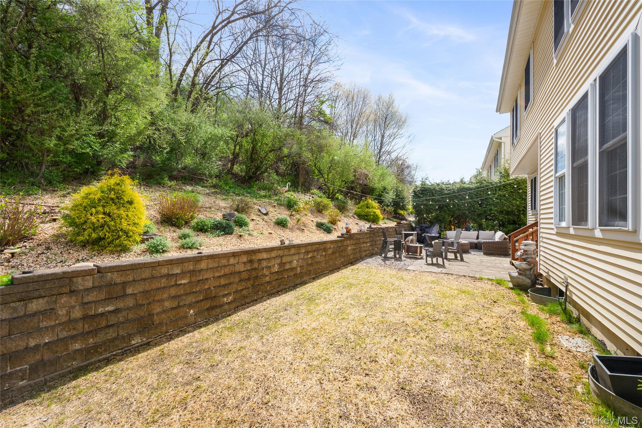 26 Bellefair Road Rye Brook, NY 10573 - Photo 20 of 25 a view of swimming pool with outdoor seating and plants
