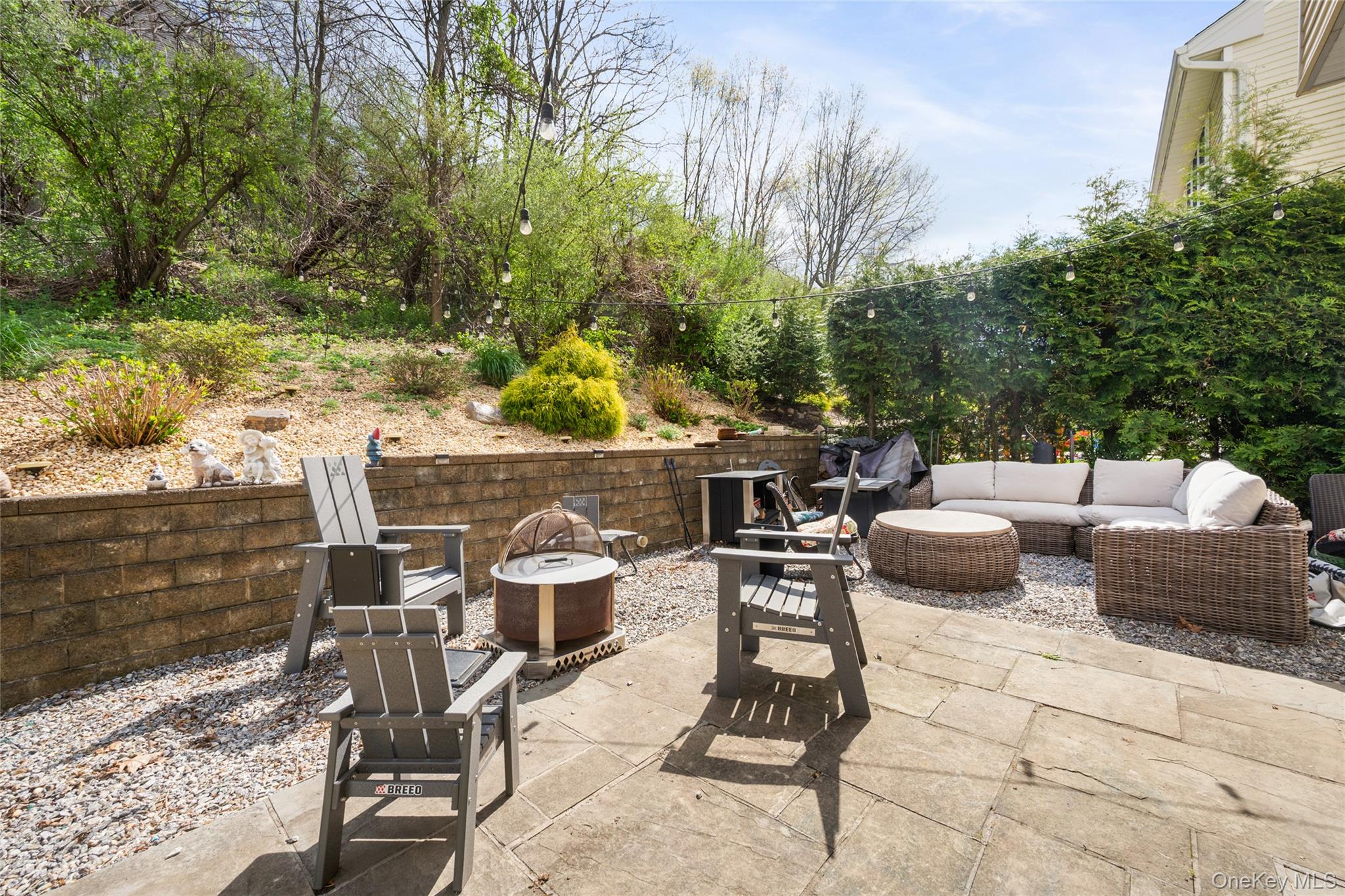 26 Bellefair Road Rye Brook, NY 10573 - Photo 21 of 25 a view of a patio with table and chairs and potted plants