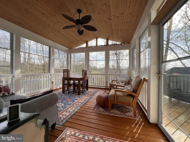 a spacious bedroom with a bed and a view of bedroom