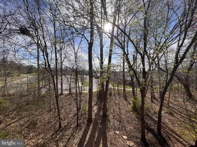 a en suite bathroom with a toilet a sink and a mirror