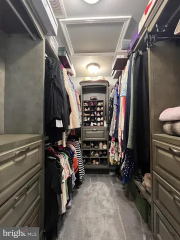 a bathroom with a granite countertop sink and a window
