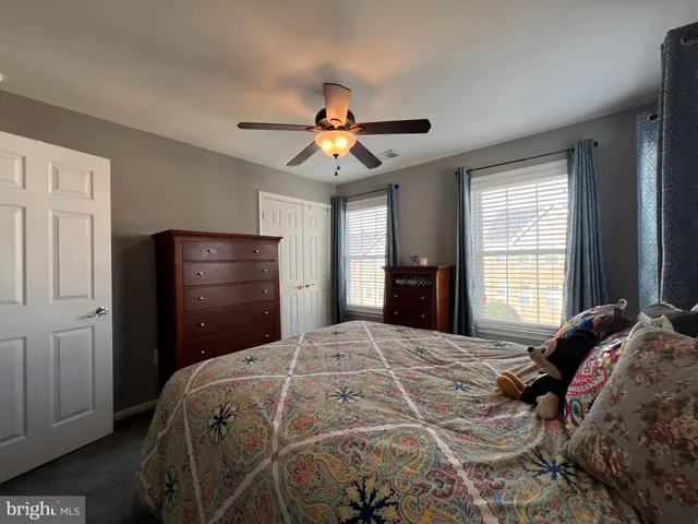 a room with a bed and window