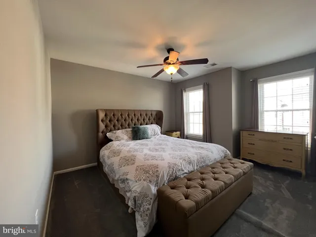 a bedroom with a bed and gym equipment