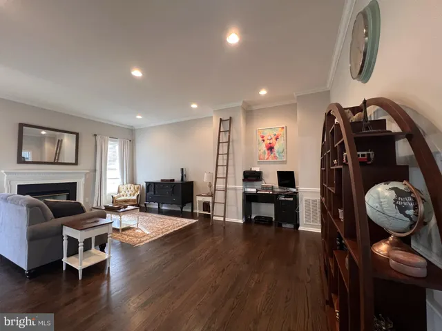 a view of a livingroom with furniture and wooden floor