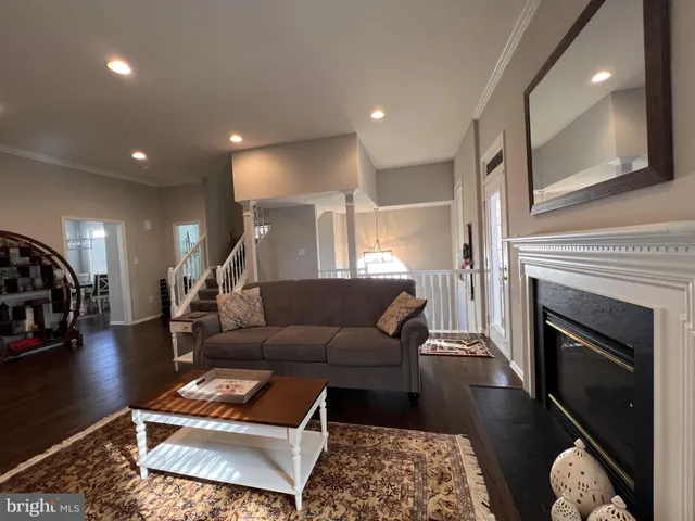 a living room with furniture and a rug