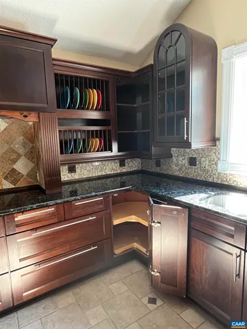 a bedroom with a bed and a ceiling fan