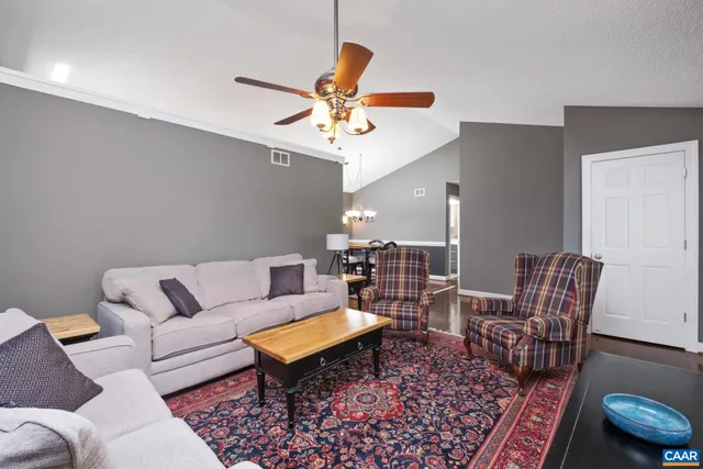 a bedroom with a bed table and window