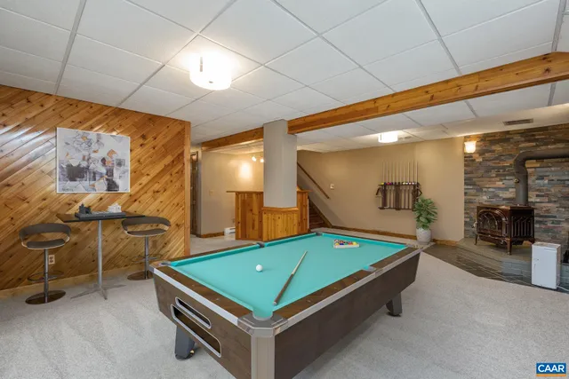 a view of a house with backyard sitting area and garden