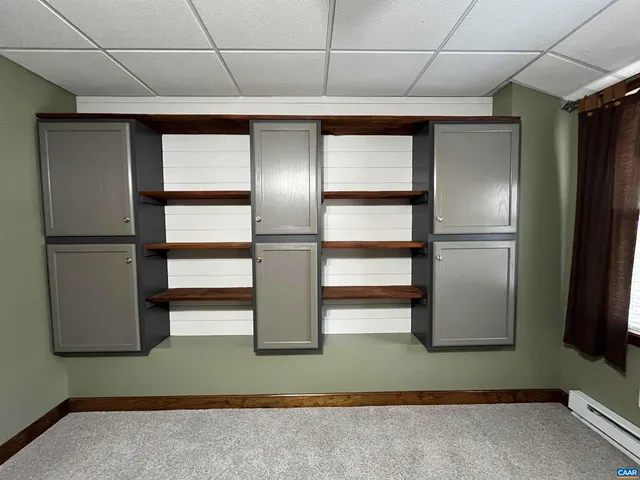a view of a porch with furniture and garden