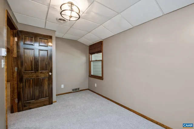 an aerial view of a house with a yard and garden
