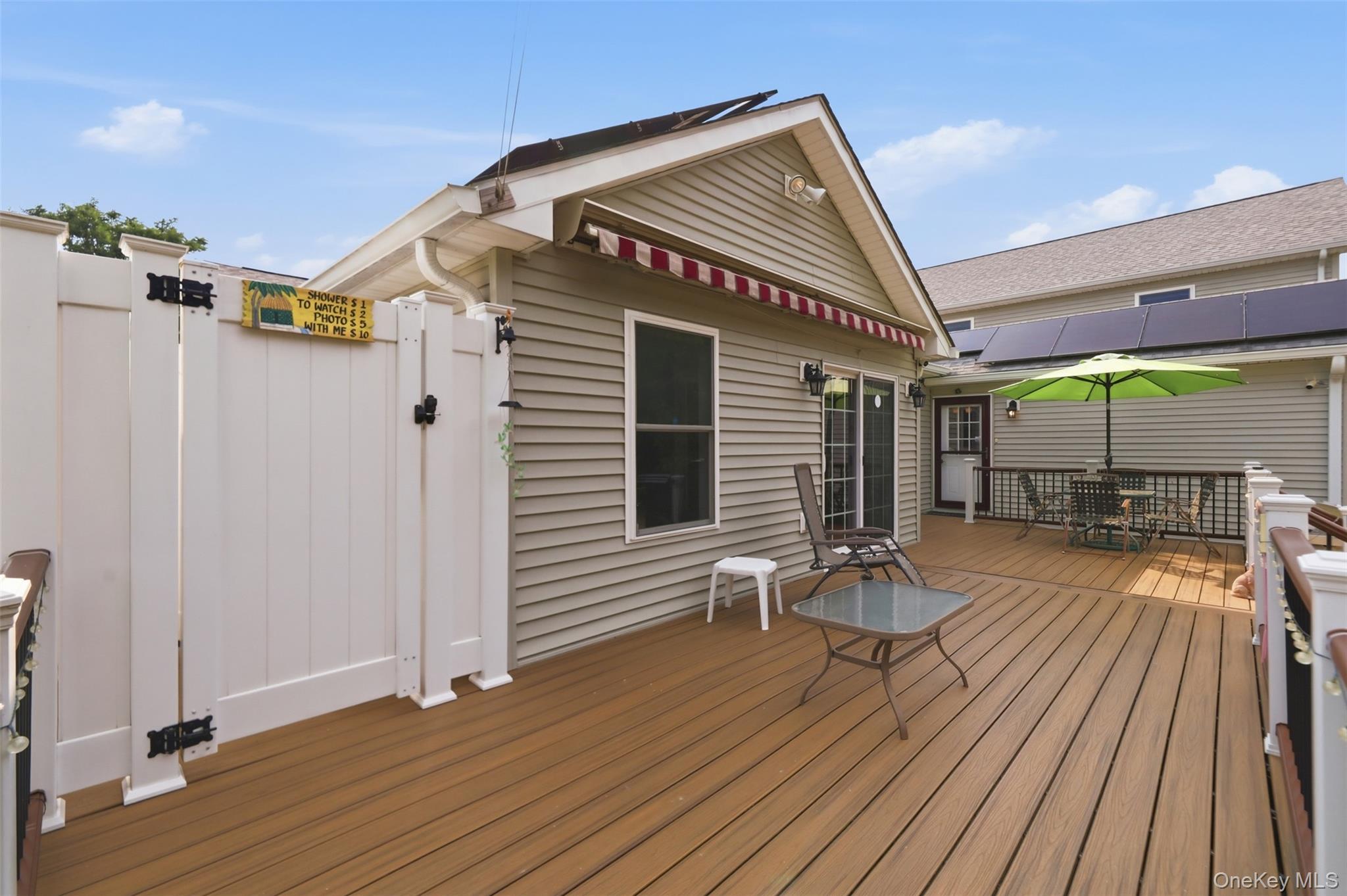 1 Hiko Place Fishkill, NY 12524 - Photo 39 of 41 Wood-finish composite decking with white railings and outdoor shower