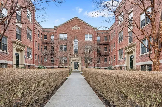a view of a brick building next to a building