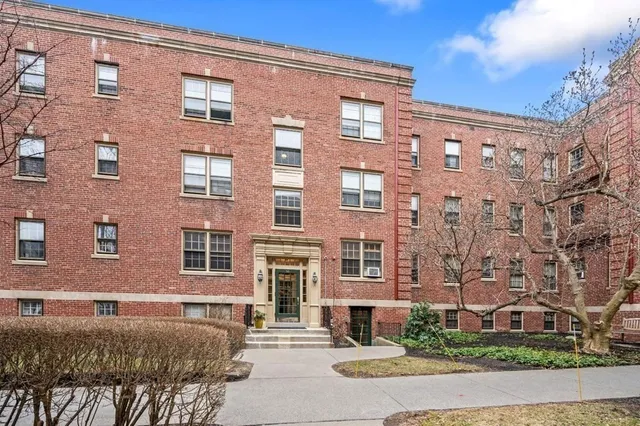 a front view of a building with garden