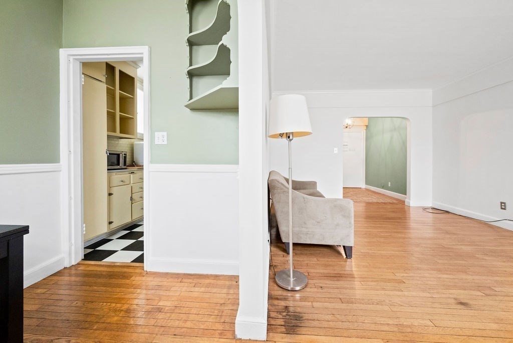 56 Elm Street, Unit 1 Worcester, MA 01609 - Photo 5 of 22 a living room with furniture and a wooden floor