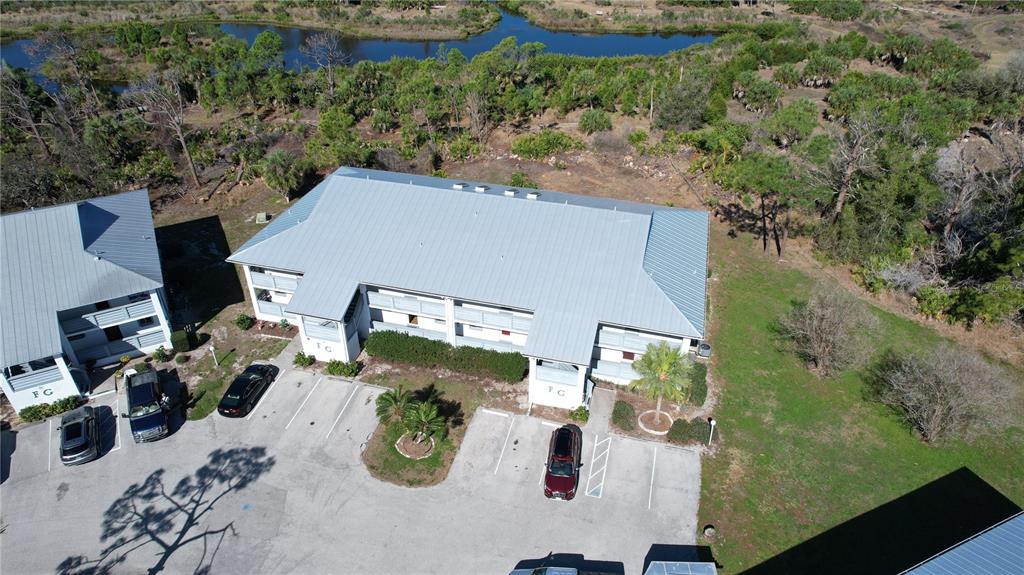 6800 Placida Road, Unit 163 Englewood, FL 34224 - Photo 1 of 24 an aerial view of a house with outdoor space