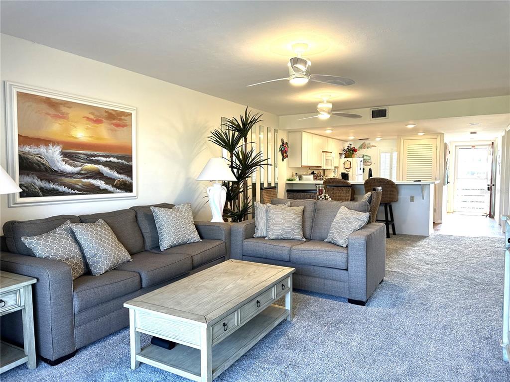 6800 Placida Road, Unit 163 Englewood, FL 34224 - Photo 13 of 24 a living room with furniture and a flat screen tv