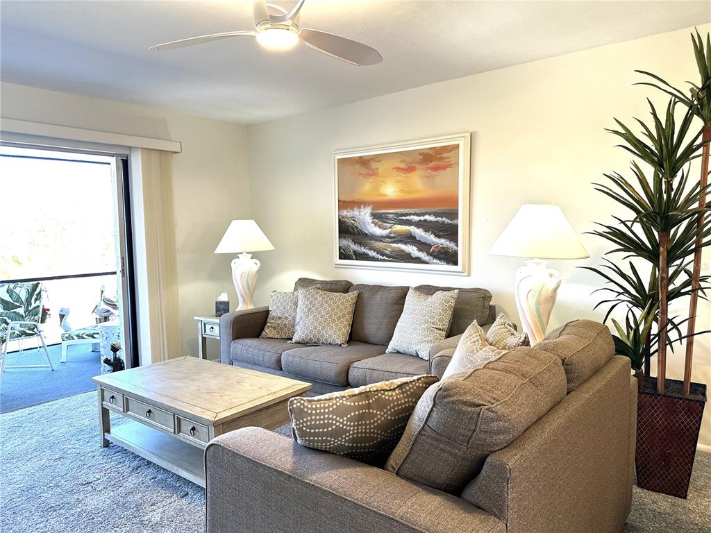 6800 Placida Road, Unit 163 Englewood, FL 34224 - Photo 14 of 24 a living room with furniture flowerpot and a window