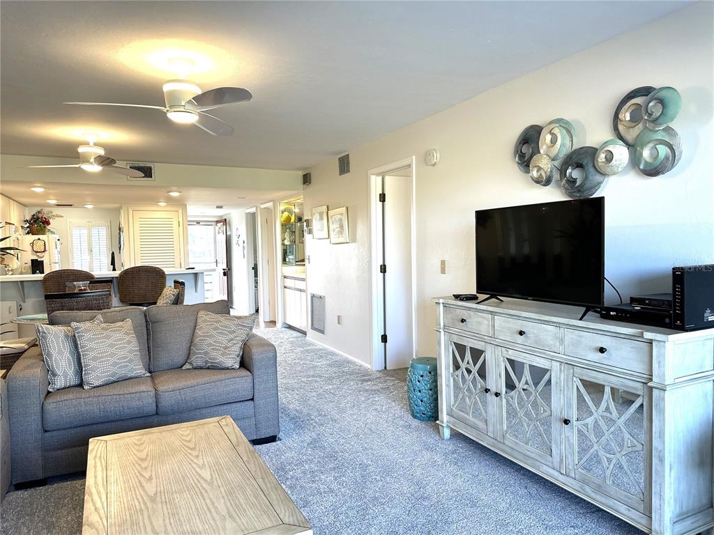 6800 Placida Road, Unit 163 Englewood, FL 34224 - Photo 15 of 24 a living room with furniture and a flat screen tv