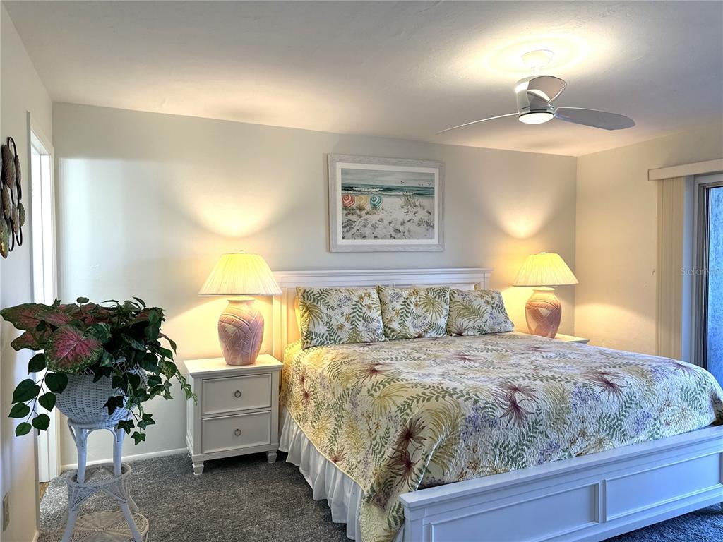 6800 Placida Road, Unit 163 Englewood, FL 34224 - Photo 16 of 24 a bed room with a bed and a lamp