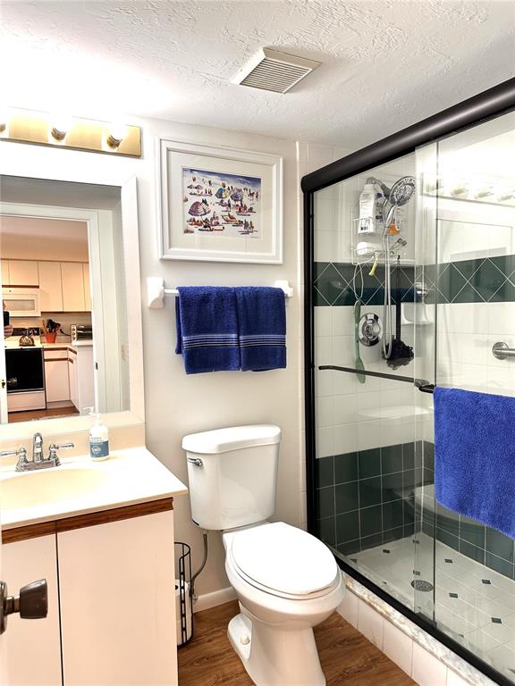 6800 Placida Road, Unit 163 Englewood, FL 34224 - Photo 20 of 24 a bathroom with a toilet a sink and a large mirror