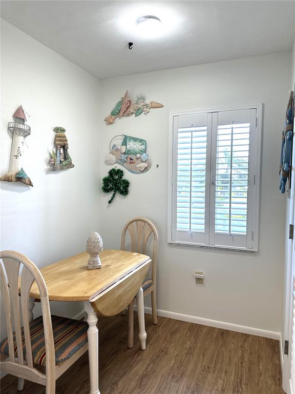 6800 Placida Road, Unit 163 Englewood, FL 34224 - Photo 8 of 24 a view of a dining room with a table and chairs