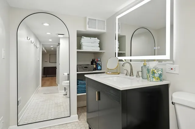 a bathroom with a sink and a mirror