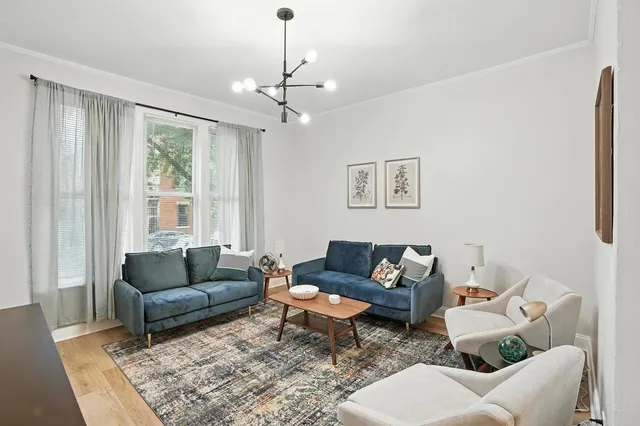 a living room with furniture and a window