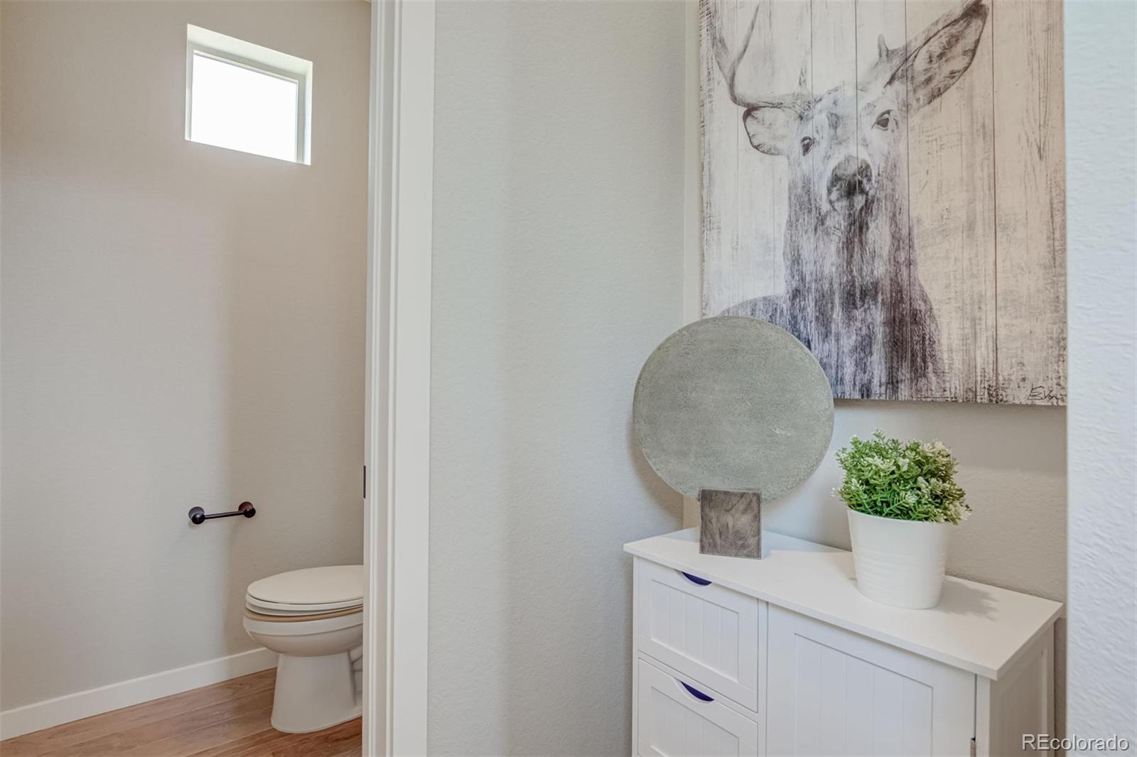 1188 Sugarloaf Road Boulder, CO 80302 - Photo 17 of 35 a bathroom with a toilet sink and mirror