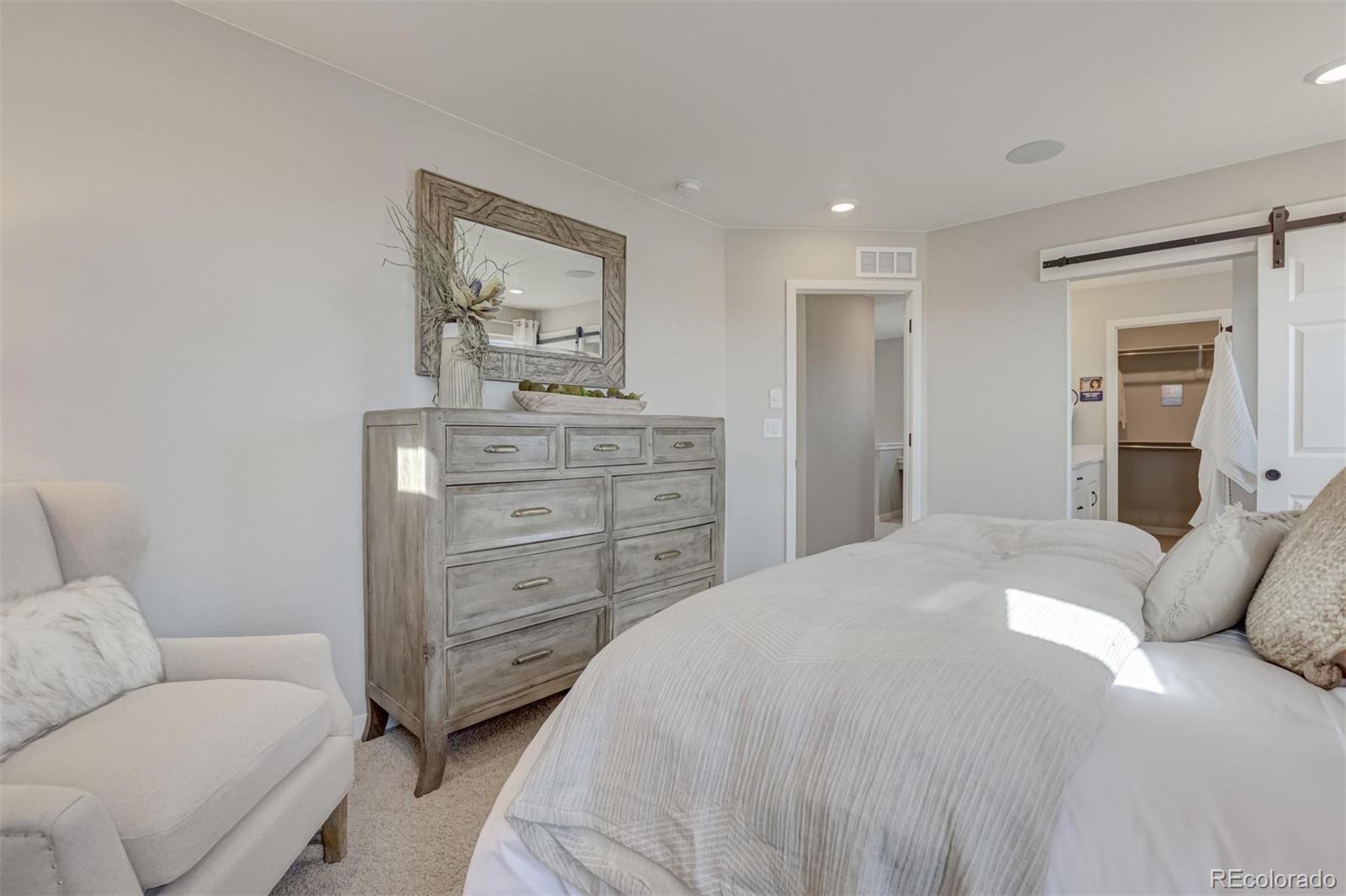 1188 Sugarloaf Road Boulder, CO 80302 - Photo 22 of 35 a bedroom with a bed and closet