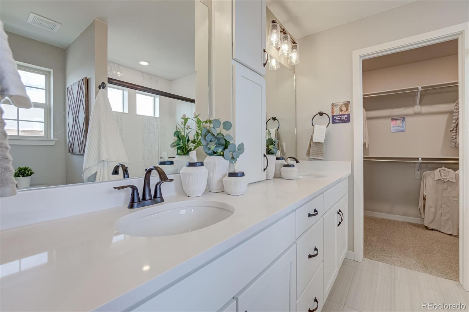 1188 Sugarloaf Road Boulder, CO 80302 - Photo 23 of 35 a bathroom with a double vanity sink mirror and shower
