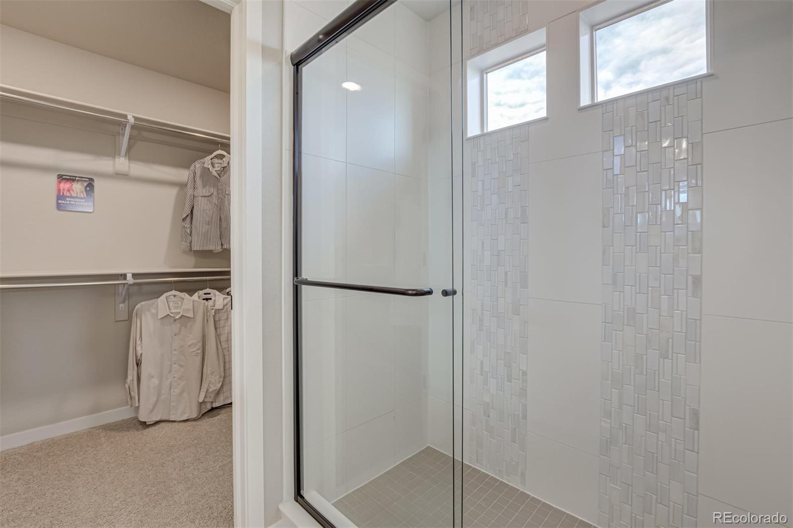 1188 Sugarloaf Road Boulder, CO 80302 - Photo 24 of 35 a bathroom with a glass shower door