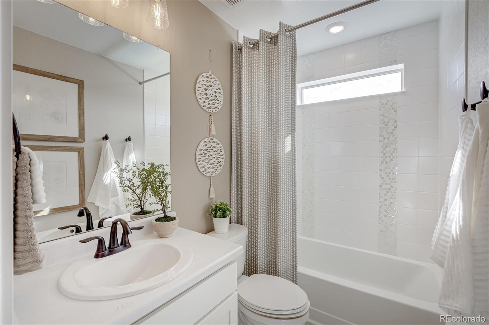 1188 Sugarloaf Road Boulder, CO 80302 - Photo 26 of 35 a bathroom with a sink a toilet a mirror a vanity and shower