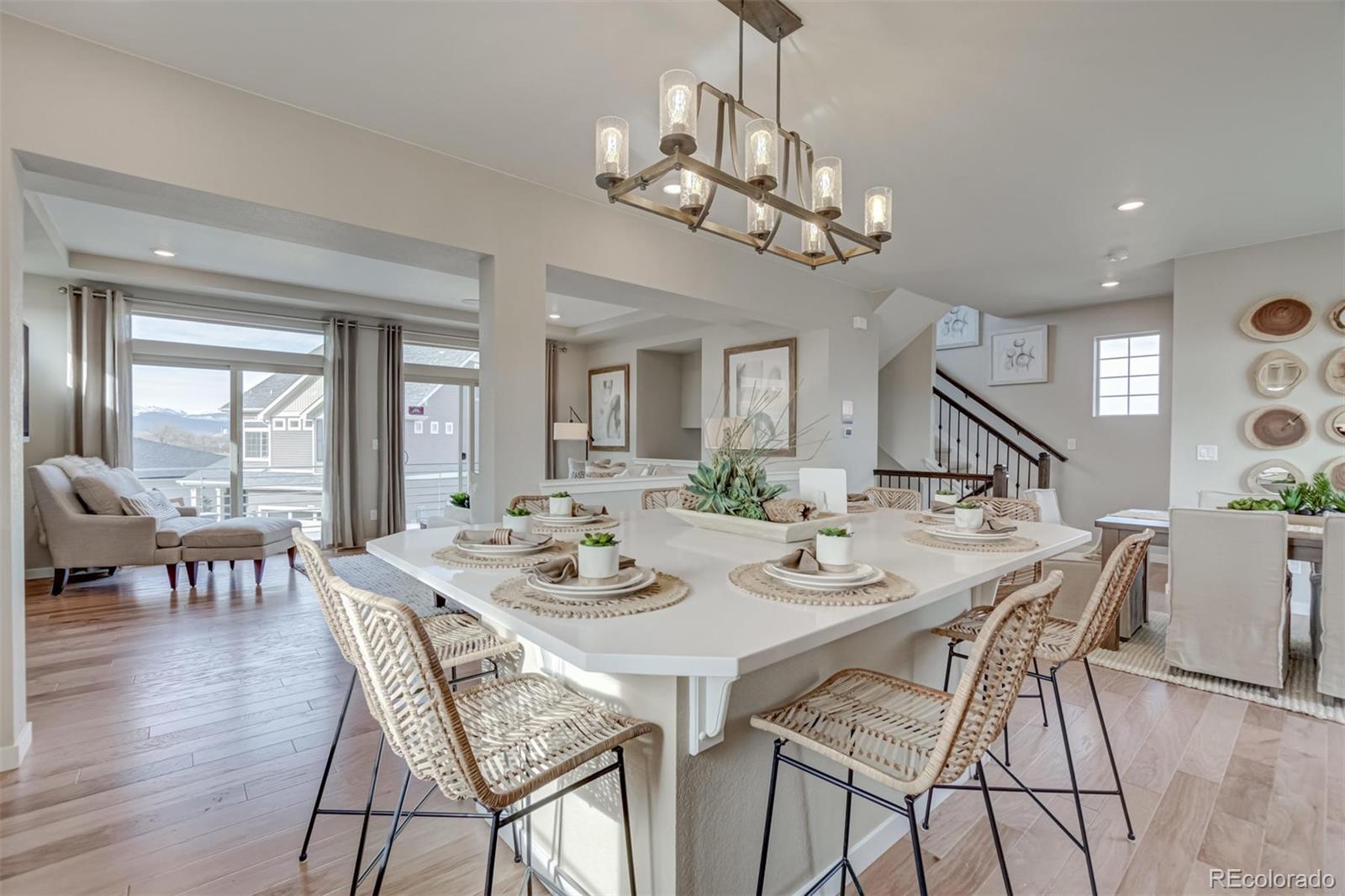 1188 Sugarloaf Road Boulder, CO 80302 - Photo 9 of 35 a view of a dining room with furniture a chandelier and wooden floor