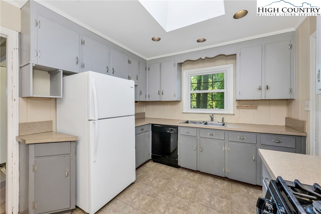 5524 Seacroft Road Charlotte, NC 28210 - Photo 11 of 36 a white refrigerator freezer sitting in a kitchen