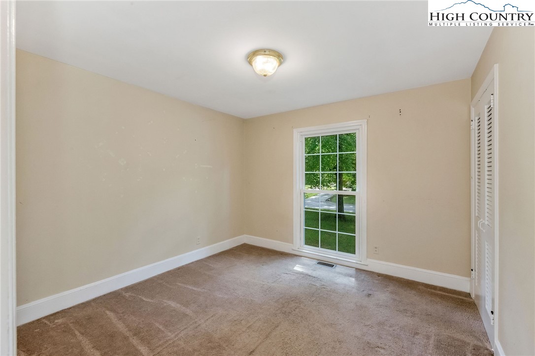 5524 Seacroft Road Charlotte, NC 28210 - Photo 19 of 36 a view of an empty room with a window