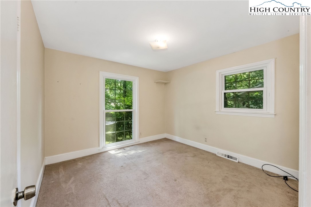 5524 Seacroft Road Charlotte, NC 28210 - Photo 23 of 36 an empty room with windows