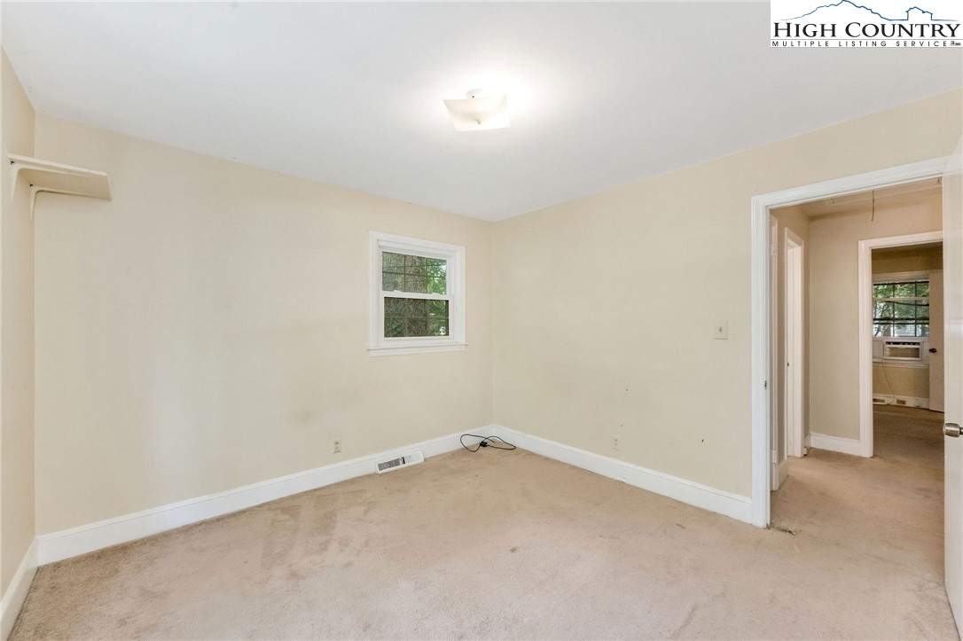 5524 Seacroft Road Charlotte, NC 28210 - Photo 24 of 36 an empty room with a window