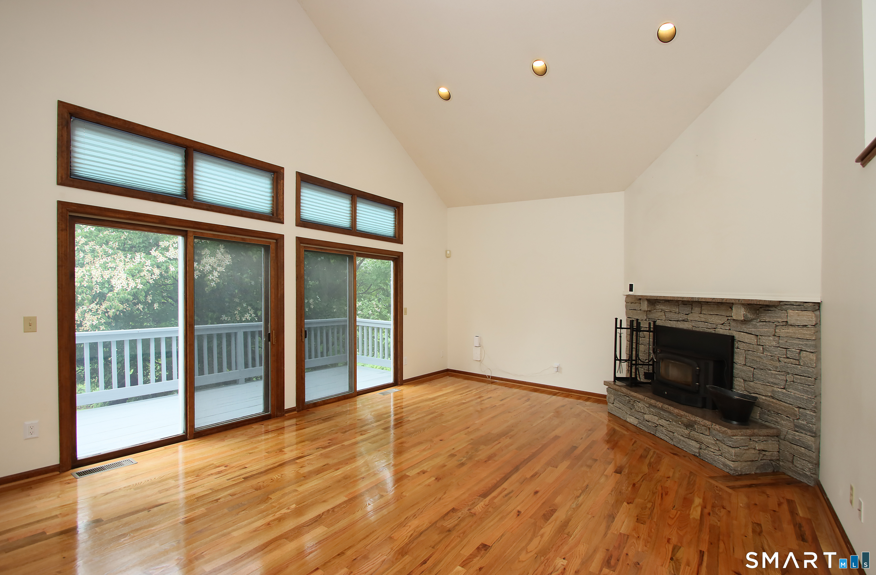 352 Center Street Wolcott, CT 06716 - Photo 15 of 40 a view of an empty room with wooden floor and a window