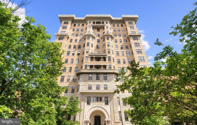 a front view of a building with glass windows and door
