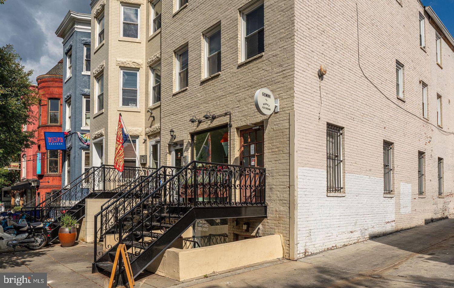 1615 Q Street Northwest, Unit 301/303 Washington, DC 20009 - Photo 24 of 53 a front view of a building with glass windows