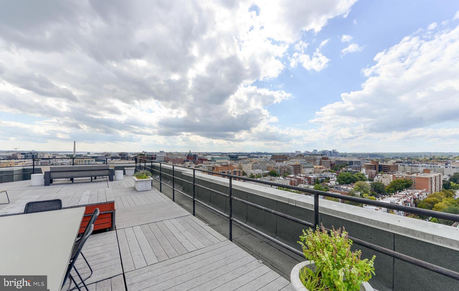1615 Q Street Northwest, Unit 301/303 Washington, DC 20009 - Photo 31 of 53 a view of a terrace with seating space