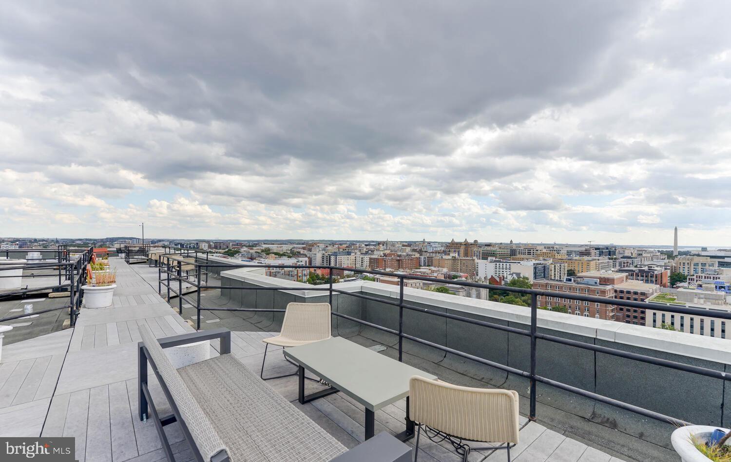 1615 Q Street Northwest, Unit 301/303 Washington, DC 20009 - Photo 33 of 53 a view of a terrace with seating area