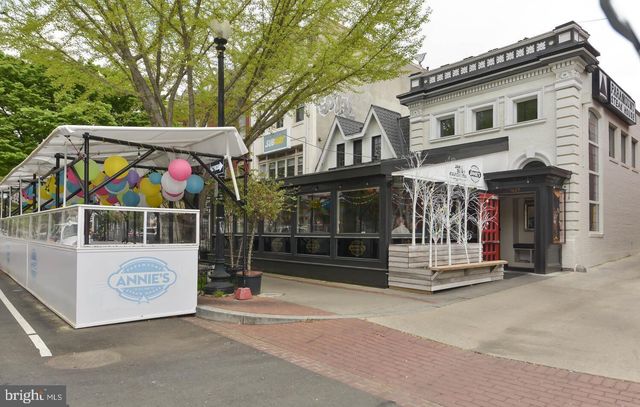 a view of a white building with large windows