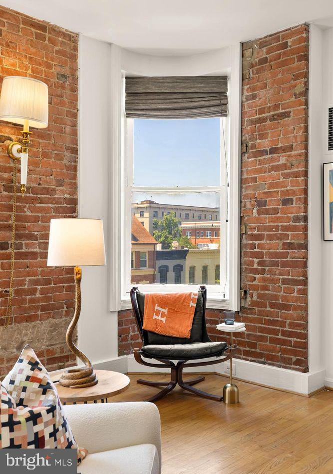 1615 Q Street Northwest, Unit 301/303 Washington, DC 20009 - Photo 4 of 53 a living room with furniture and a lamp