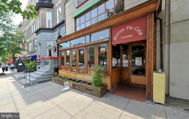 a front view of a building with glass windows